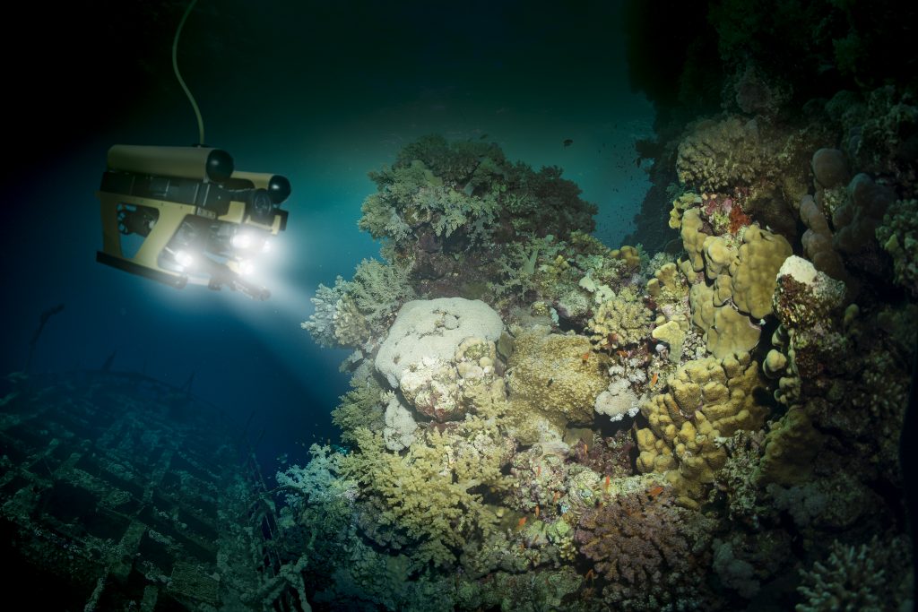Robot inspects a sunken ship deep under water